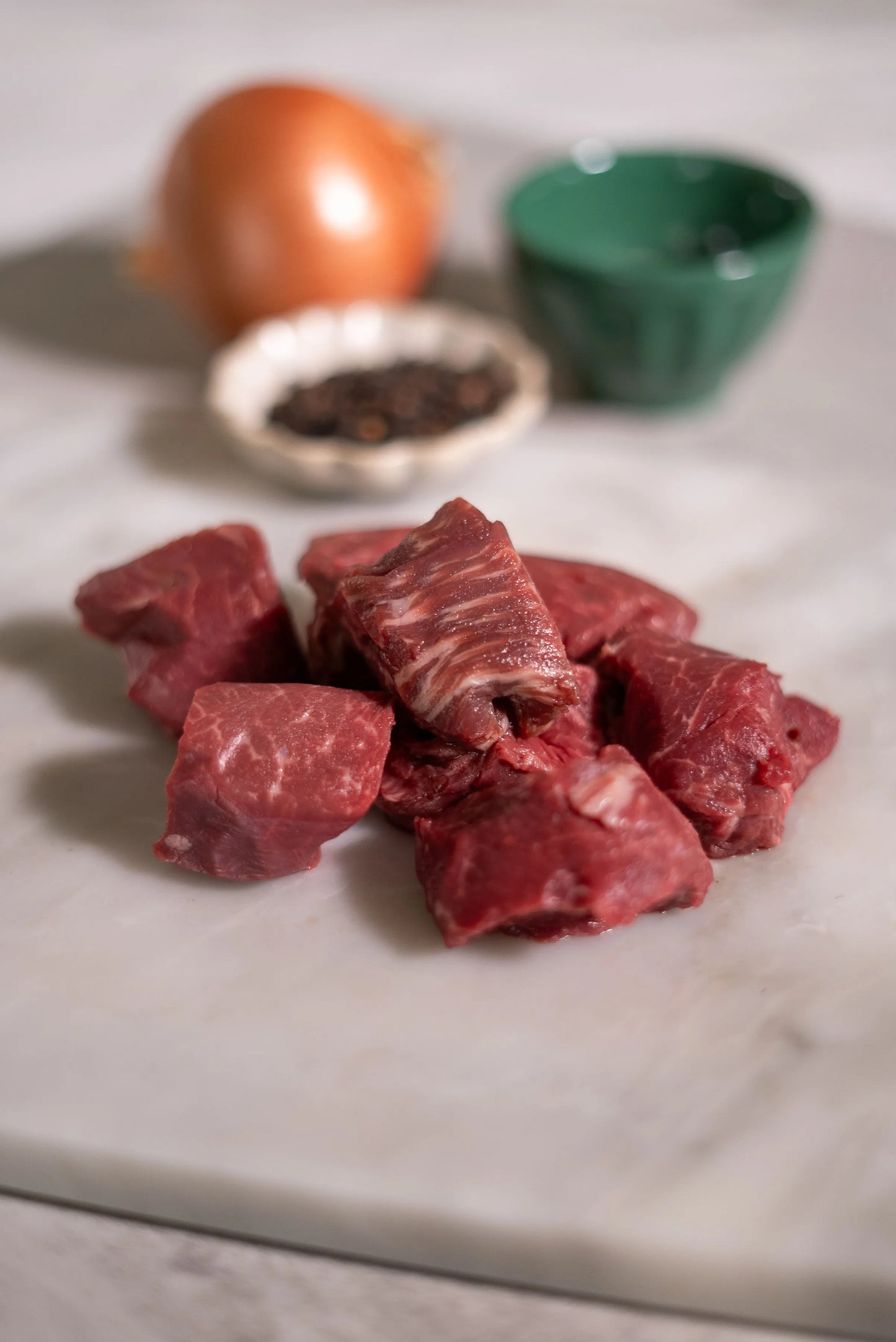 Raw beef chunks on a marble plate, halal -wagyu
